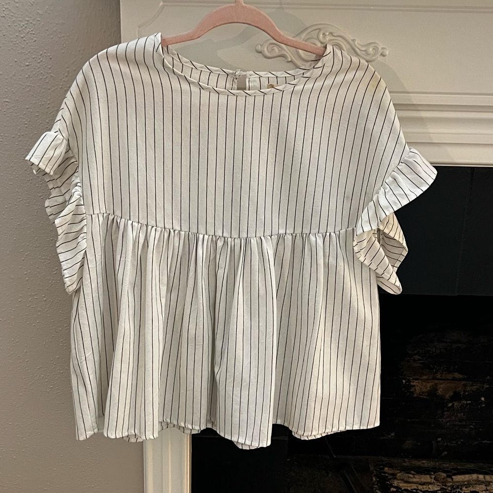 White and black peplum style blouse